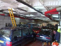 Looking aft from the port forward car deck access door. Note the cars all pointing aft, and the cockpit ladder locked in the down position. Further along in the shot on the far wall notice a change in height of the car deck roof into what appears to be an alcove. This is the area originally designated extra passenger space in the Mk I version of the SRN4, and is also the area where the 19m extension of the two Super-4 craft was inserted during their expansion in the '80s.